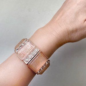 Rose-gold color bracelet with rhinestones. Very sparkly